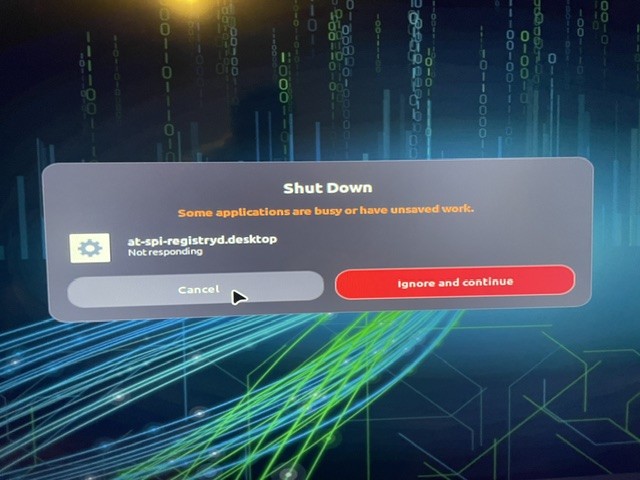 Phone photo: a shutdown dialog saying at-spi-registryd is not responding